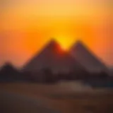 Ancient Egyptian pyramids standing majestically against the sunset sky