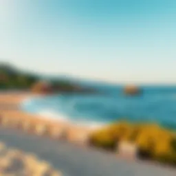 A stunning view of Meridian Beach showcasing its golden sands and clear waters under a blue sky